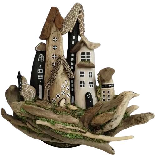 Decorative arrangement of small houses made from driftwood and stones on a white background